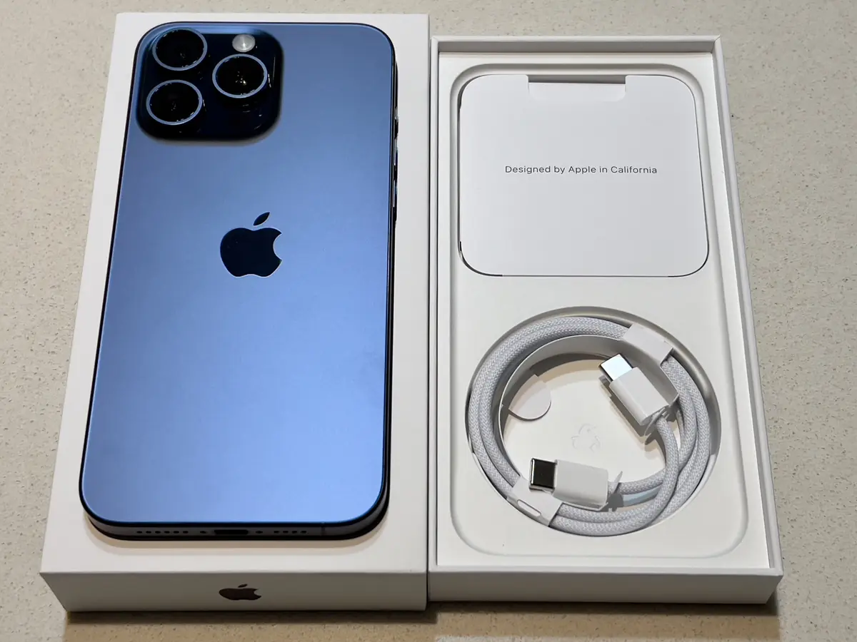 iPhone 15 Pro Max with its box and cable